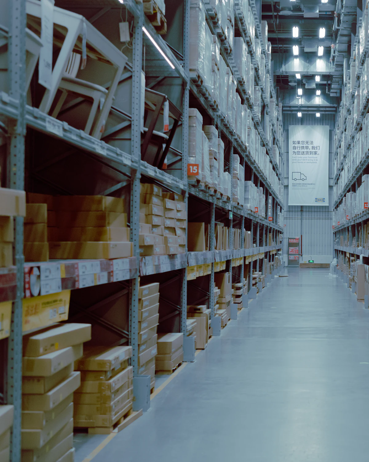 Long aisle of stocked warehouse shelving